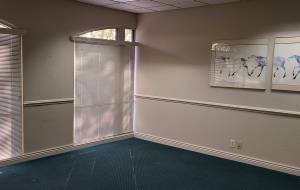 Office space with blinds drawn.
